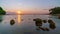 Timelapse Long exposure with motion blur of Amazing seascape over rocky in sunset or sunrise sky over sea and stone rocks in the f