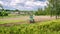 Timelapse. Mini skid steer loader clear the construction site.