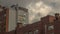 Timelapse of a modern brick building and clouds passing by