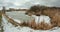 Timelapse, mooving clouds over small frozen pond