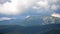 Timelapse mountain landscape with moving clouds