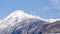 Timelapse mountain with snow and clouds