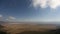 Timelapse of moving rainclouds over African savannah.