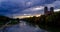 Timelapse of Munich at dramatic sunset - Isar river, trees, church. Munchen, Bavaria, Germany