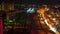 Timelapse night city, cars road, buildings, winter. Night view of cars move along the roads of the night city in winter