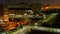 Timelapse of the night city, top view, people walking, passing cars. Selective focus