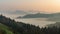 Timelapse panoramic foggy landscape at dawn over mountain and valley. Slovenia. Dancing fog