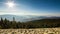 Timelapse of a partly cloudy desert sunrise viewed from a mountain pass. Shot in HDR. Includes hyperlapse panning motion