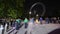 Timelapse of people at night in Jubilee Park in front of the London Eye queuing to see Queen Elizabeth ii lying in state