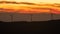 Timelapse of a power farm wind turbine spinning while sunset time. Footage B-roll Windmill, Green Energy, Global warming, renewabl