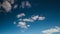 Timelapse rolling clouds, Clouds running across brilliant blue sky, Cumulus cloud form against a dark blue sky