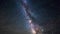 Timelapse of starry sky in the desert. Milky Way and traces of aircraft.