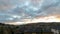 Timelapse of stormy clouds over residential homes in Happy Valley Or sunset 4k