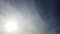 Timelapse stratocumulus  clouds floating in sky with shining light and sun