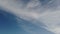 Timelapse stratocumulus clouds moving higher in the sky with left copy space