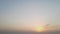 Timelapse, sunrise in a light haze through the clouds. Copy space.