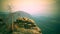 Timelapse at sunrise over misty landscaspe. Clouds flow over forests