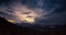 Timelapse of sunset on mountains with epic cloudy sky at evening on travel