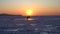 Timelapse of a sunset over the icy surface of the sea