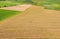 Timelapse Time lapse Dronelapse Hyperlapse. Aerial View Tractor Collects Dry Grass In Straw Bales In Wheat Field