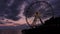 Timelapse or time lapse of The Great Wheel and boats at sunset, Pier 57, Seattle, Washington, USA
