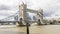 timelapse Tower bridge with passing boats on the Thames on a cloudy day