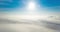 Timelapse view above the fog or white clouds with shining sun. Beautiful sunrise cloudy sky from aerial view. Above