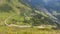 Timelapse, View on a serpentine road with car traffic on it high in the mountains. The Gotthard Pass, Canton Ticino, Switzerland