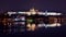Timelapse of vltava river at charles bridge and prague castle at night with reflections