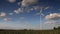 Timelapse - Wind Turbines under a partly cloudy sky