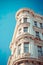 timeless beauty of an old building against the backdrop of a clear blue sky.