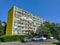 Timeless communist-era block of flats under a blue sky, echoing history amidst urban life