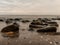 Timeless Motion: Serene Seascape with Rocks in Long Exposure, Capturing Nature\\\'s Fluidity and Stillness in Harmony