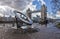 Timepiece sundial and Tower Bridge in London, UK