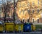 Timisoara, Romania-February 26, 2020: yellow and blue garbage cans full to the brim, in the center of the largest city in the west
