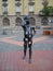 Timisoara / Serbia - October 24, 2019: volumetric metal sculpture of a boy with square holes talking on a cell phone. One hand on