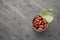 Tin can of canned kidney beans on grey table, top view. Space for text