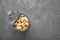 Tin can of canned white kidney beans on grey table, top view. Space for text