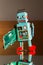 Tin toy robot carries computer circuit board, artificial intelligence concept