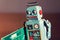 Tin toy robot carries computer circuit board, artificial intelligence concept