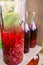 Tincture bottles of lemon, currant, berries and rowanberries. Herbal medicine. Spirits, wine and liqueur