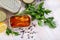 Tinned sardines in tomato sauce on background with greens and lemon