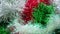 Tinsel-rain of red, white, green and golden color. New Year Christmas decorations for Christmas tree, interior or party