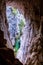 The Tinted Cave offers a window out to the Mares Forest Creek Canyon