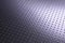 Tinted violet or purple metal tech background. Dark wallpaper. Perforated aluminum surface with many holes. Their ranks go into