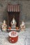 Tiny altar with incense and porcelain statues in a Chinese temple