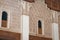 Tiny arch window on ancient Arabian style architecture in Marrakech