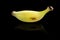 Tiny banana on a black background