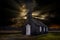 The tiny black church called the BÃºÃ°akirkja sits alone among a field of lava rock - Iceland