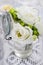 Tiny bouquet of white eustoma flowers and green hypericum plant